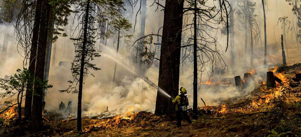 California Fights to Control Raging Wildfires as Threat of Flash Floods Grows