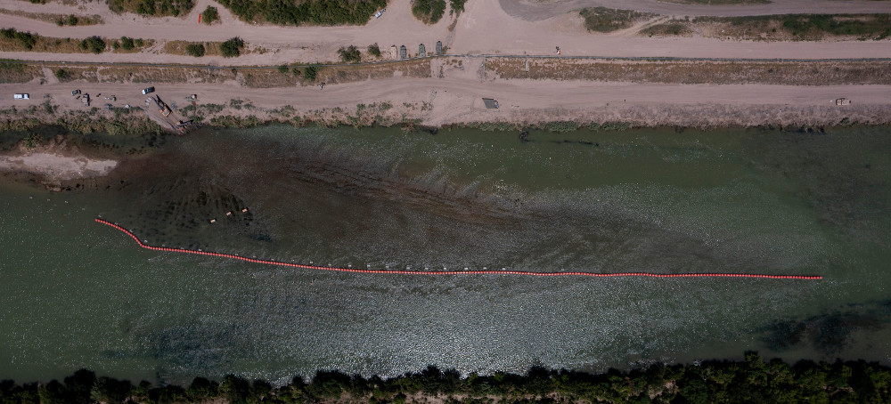 DOJ to Sue Texas Over Gov. Abbott's Floating Wall, Razor Wire Along the Rio Grande