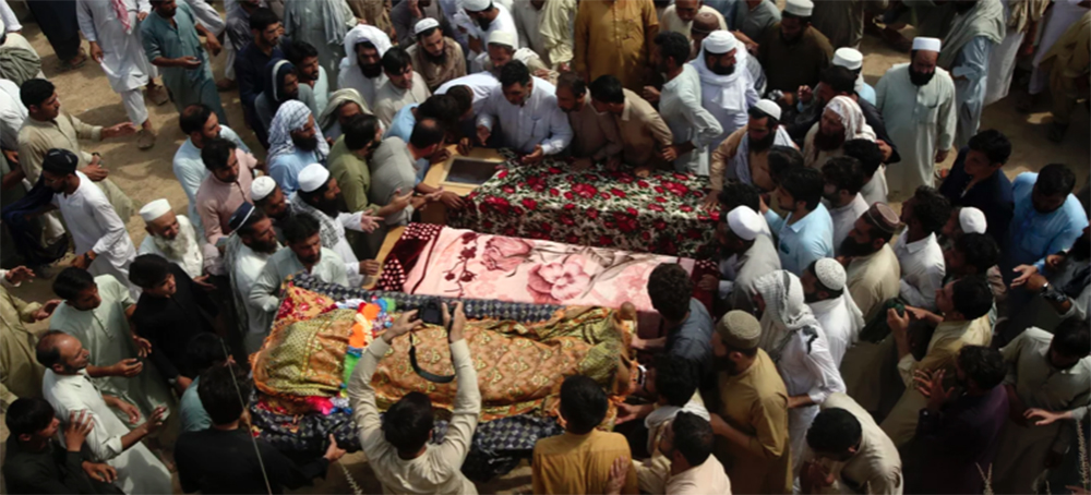 The Death Toll in the Pakistan Suicide Bombing Rises as Families Hold Funerals