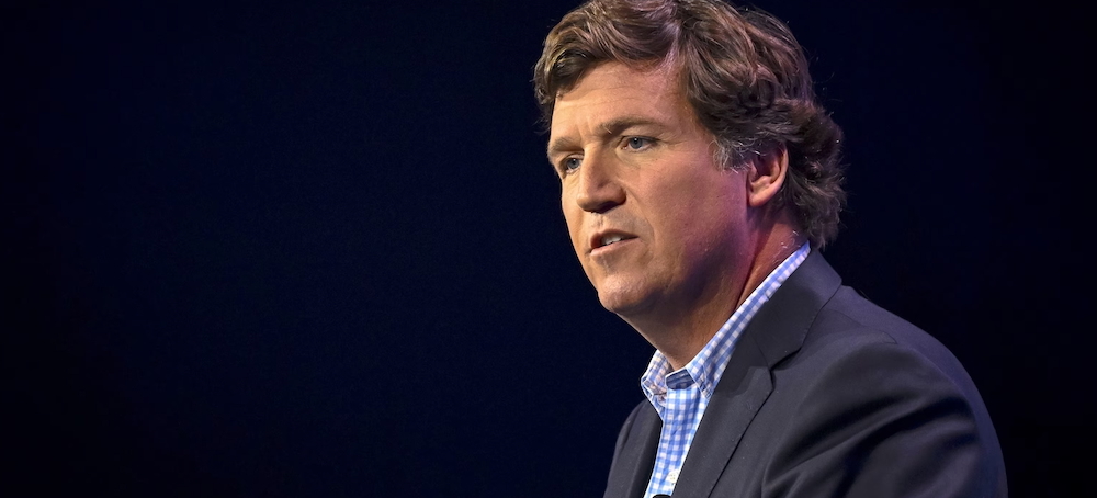 The Conspiracy Theory Behind Tucker Carlson’s Apology